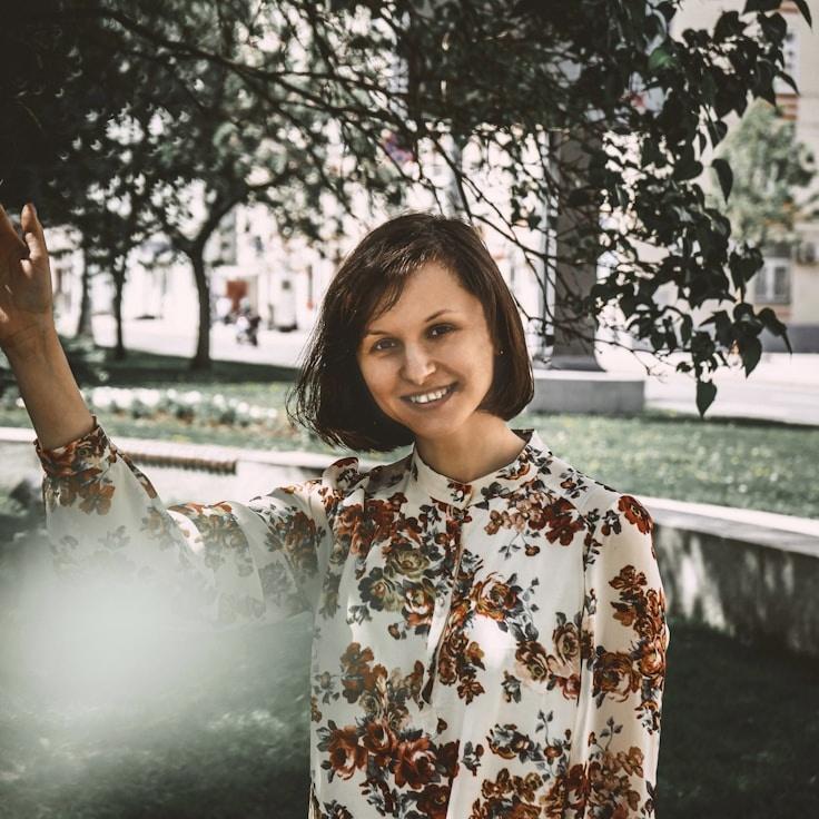 Ariadne Sharma, Lead Design Curator at Paper Font Kit, reviewing corporate floral arrangements